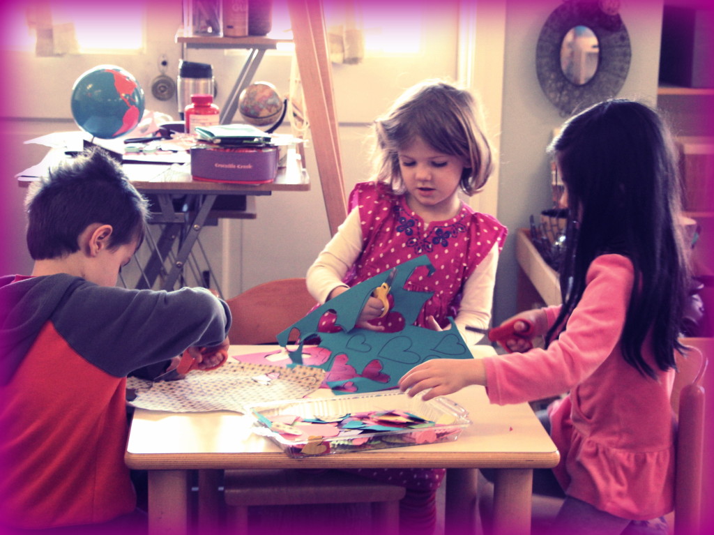Some older students helping we teachers prepare for Valentine's crafts 